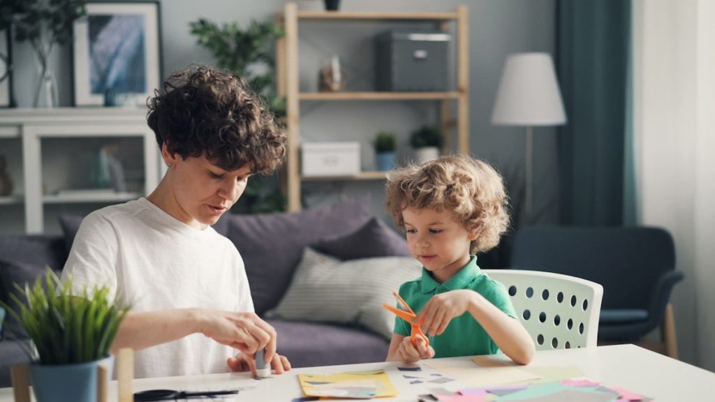 a man and a child sitting at a table